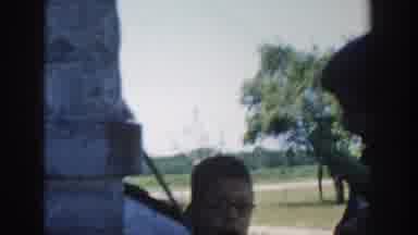 Michigan USA (1958): Two Boys On A Porch And One Is Gesturing With An Unshucked