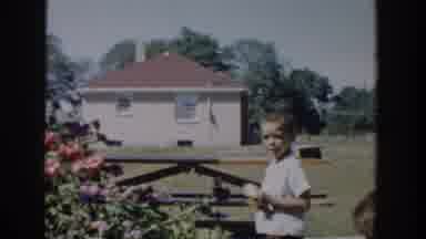 Michigan USA (1958): Boys Play In Flower Garden In Beautiful Sunny Day On Very