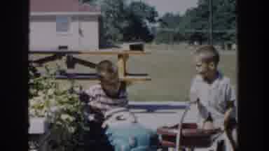 Michigan USA (1958): Boys With Toys Outside The House On A Sunny Day While Your