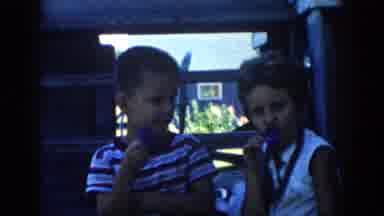 Michigan USA (1958): The Two Childrens Are Eating The Tasty Ice Cream With Smiling