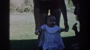 Michigan USA (1958): Small Girl Standing In Front Of Adult Takes Three Small