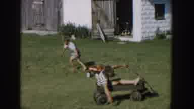 Michigan USA (1958): Three Children Are Playing On The Ground Happily With The