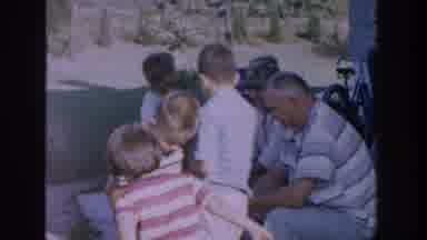 Michigan USA (1958): Men Bots Line Push Wagons