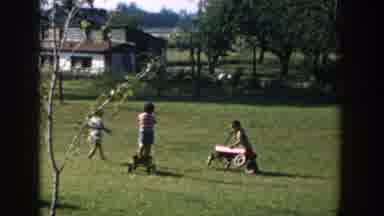 Michigan USA (1958): Children Enjoy A Nice Day Outside By Playing Games Together