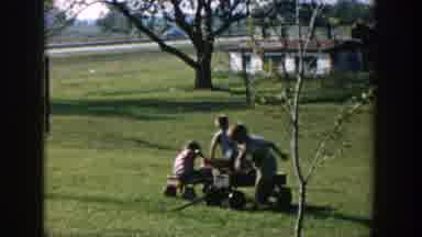 Michigan USA (1958): The Three Children's Playing In The Garden By Using Small