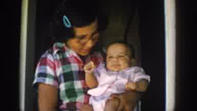 Michigan USA (1958): Loving Sister Is Playing With Her New Born Baby Sister