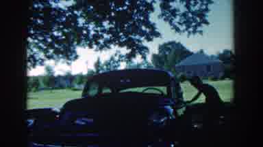 Michigan USA (1958): A Man Washing His Car At Night