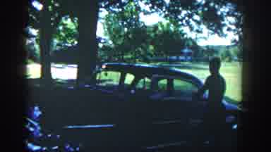 Michigan USA (1958): Children In A Field And A Vintage Car On A Sunny Day