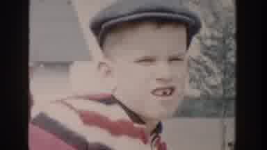 Michigan USA (1958): Small Boy Trying To Smile To The Camera And The Same Boy