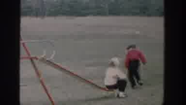 Michigan USA (1958): Children Run To Play On Backyard Swingset Swings And Slide