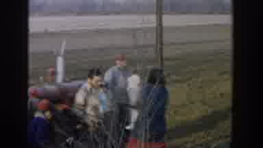 Michigan USA (1958): Multigenerational Family On A Farm Standing Near A Tractor,