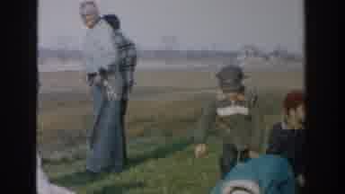 Michigan USA (1958): Vintage Children Dressed For Cold Weather Rolling On The