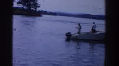 Wisconsin USA (1958): People Standing On A Boat While Others Are Playing In The