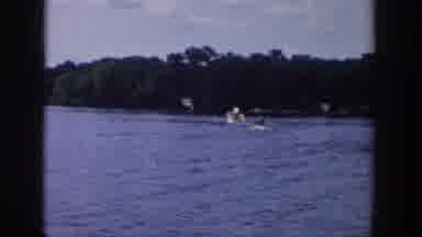 Wisconsin USA (1958): A Water Skier Is Being Pulled Behind A Boat On A Lake
