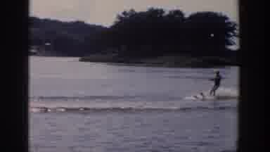 Wisconsin USA (1958): A Man Water Skiing On A Lake Being Pulled By A Motorboat