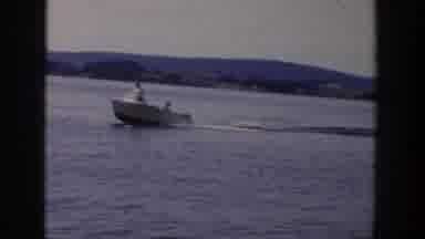 Wisconsin USA (1958): A Person Ride The Boat And Another Person Follow The Boat