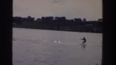Wisconsin USA (1958): A Person Water Skiing In The Sea Pulled By A Boat