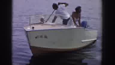 Wisconsin USA (1958): A Man And A Woman On A White Boat With A Child Sailing On
