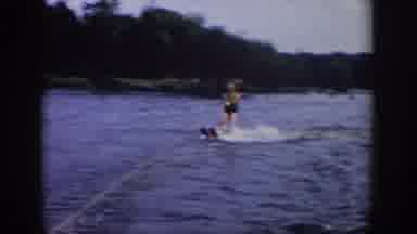 Wisconsin USA (1958): A Water Skier Is Riding Their Water Skis On A Lake As They