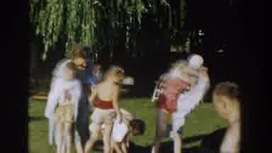 Wisconsin USA (1958): Large Family Gathering Belongings As They Leave The Beach As