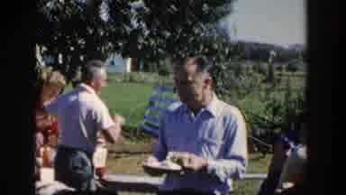 Wisconsin USA (1958): Family Celebrating With A Barbecue Walking Around