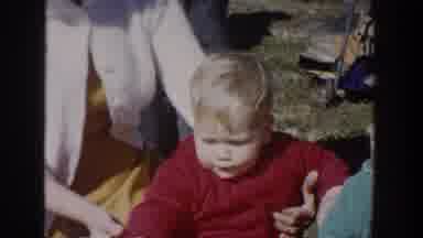 Wisconsin USA (1958): Old-School Video Of Child, Woman And Man Outside Of A Home