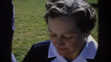 Wisconsin USA (1958): Woman Enjoys A Picnic Outside With Friends And Family