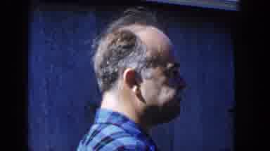 Wisconsin USA (1958): A Guy Looks At The Camera As Another Guy Turns And Looks As