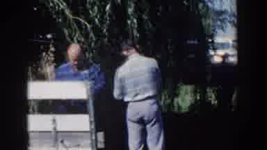 Wisconsin USA (1958): Men Looking On As A Fence Is Being Built