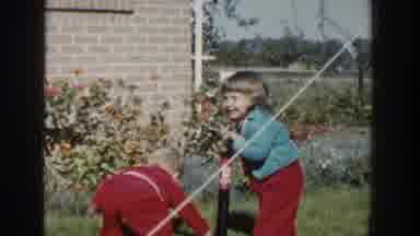 Wisconsin USA (1958): Children Playing In The Garden Or Backyard