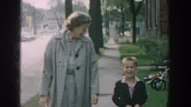 Wisconsin USA (1964): A Grandmother And A Grandson Walking Down A Neighborhood