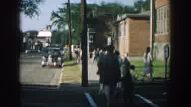 Wisconsin USA (1964): Mother And Son Walk Down The Sidewalk In A Suburban Area