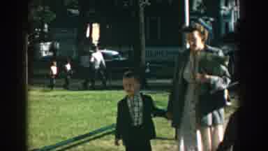 Wisconsin USA (1964): A Mother With Her Child Is Walking On The Road And One More