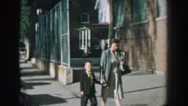 Wisconsin USA (1964): A Mother Walking With Her Son In Dress Clothes On A Sunny