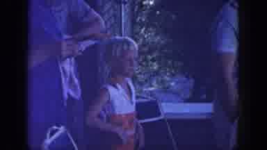 Wisconsin USA (1964): Women And Children Standing On Front Porch Reading A