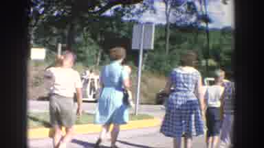 Wisconsin USA (1964): Family Walking Down Middle Of Street