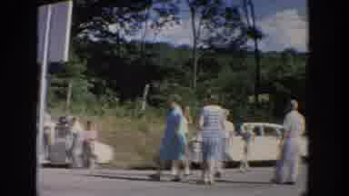 Wisconsin USA (1964): A Group Of People Finish Taking In A Tourist Attraction And