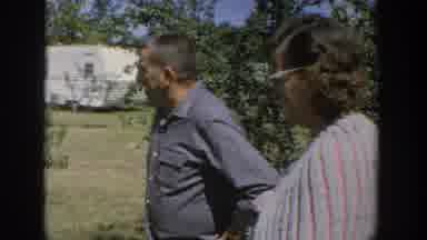 Wisconsin USA (1964): People Survey The Outdoor Area Around A Trailer On A Nice