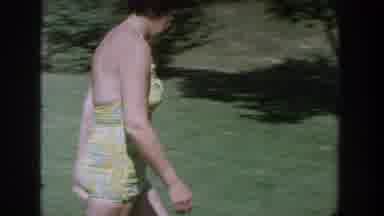Wisconsin USA (1964): Nervous Woman In Bathing Suit Runs Away From The Camera