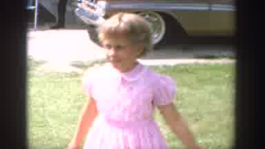 Wisconsin USA (1964): Woman With Children Outside House Some Riding Bikes On