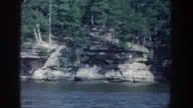 Wisconsin USA (1964): A View Of A Waterside Forest On The Side Of A Cliff