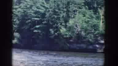 Wisconsin USA (1964): Sedimentary Rock Protrudes Along The Shore Of A Body Of