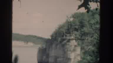 Wisconsin USA (1964): Lake Surrounded By Steep Rocky Cliffs With Trees