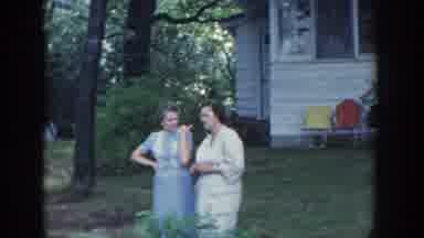 Wisconsin USA (1964): Two Young Women Talking And Then Spotting A Friend Down By