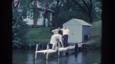 Wisconsin USA (1964): Group Of People See Child Staring At Something Lurking