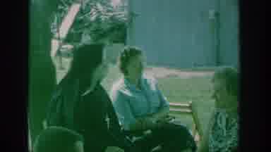 New York USA (1964): Catholic Nun Speaking To A Group Of Women, And Smiling,