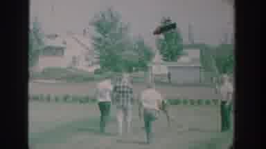New York USA (1964): White People Picking Up Stones In A Random Town Road