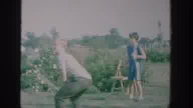 New York USA (1964): Boy Practices Batting With Adult Supervision While Other
