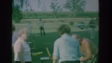 New York USA (1964): Multiple People Who Are Standing And Walking Eat And Hold