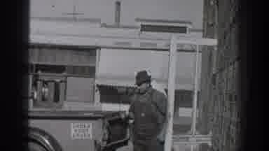 California USA (1936): Two Men Loading A Truck